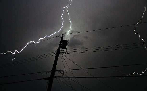 A transformer being struck by lightening.